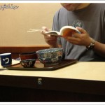 Japanese Restaurants in Tokyo | Donmono no Sakai interior customer enjoying his lunch and reading