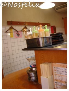Japanese Restaurants in Tokyo | Marukin Ramen  interior  counter and containers with concentrated broth