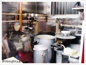 Japanese Restaurants in Tokyo Menmen Kamezo interior  kitchen area  pots with  hot ramen broth