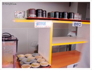 Japanese Restaurants in Tokyo Toto Don interior shelves with cups glasses and spices